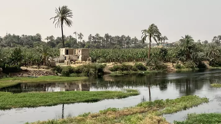 The banks of the Nile River near Qena, as seen from a river cruise boat