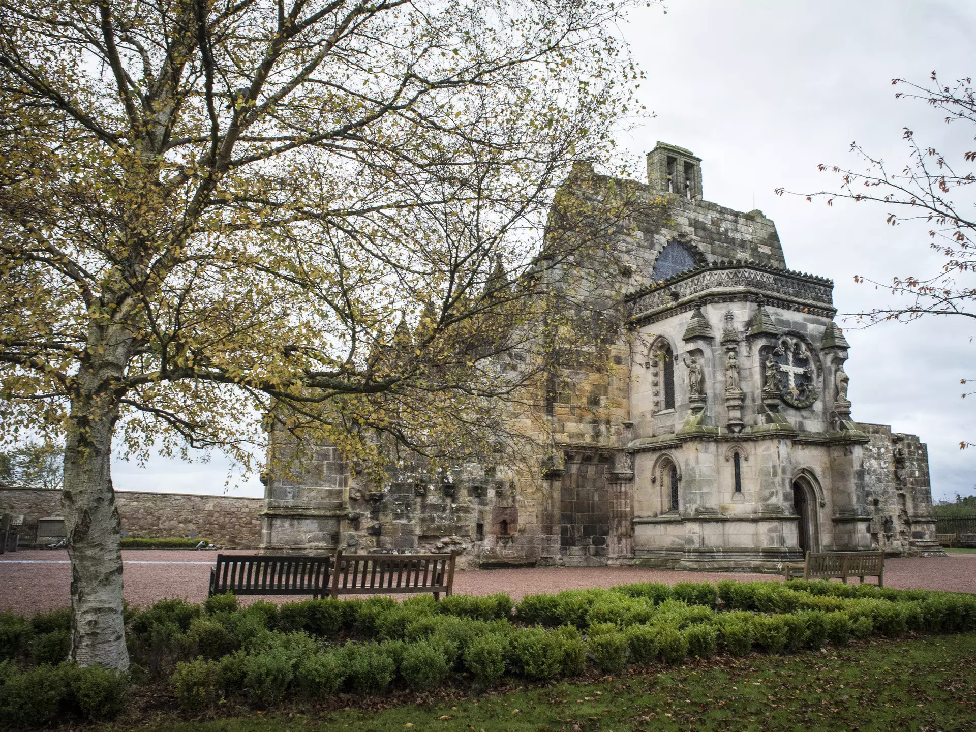 Rosslyn Chapel near Edinburgh, Scotland as pictured behind trees