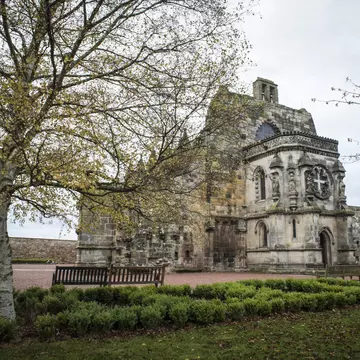 Rosslyn Chapel near Edinburgh, Scotland as pictured behind trees
