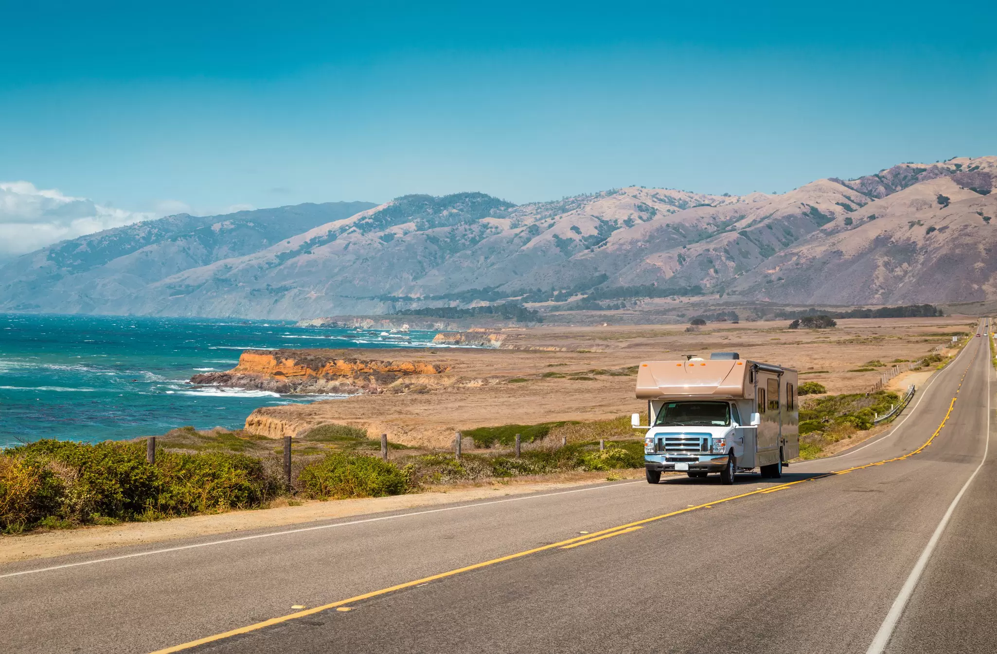 An RV cruising along the Pacific Coast Highway in California