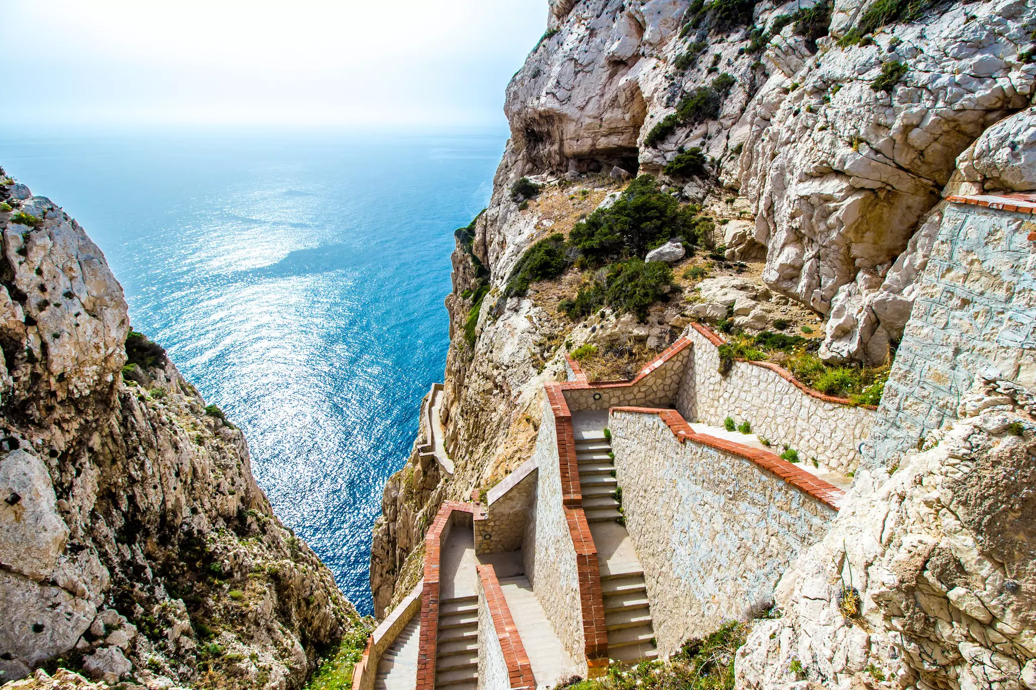 The stairway leading to the Neptune's Grotto, in Capo Caccia cliffs, near Alghero, in Sardinia, Italy, License Type: media, Download Time: 2025-02-13T14:45:24.000Z, User: catalinaaragon, Editorial: false, purchase_order: 56530 - Guidebooks, job: Global Publishing WIP, client: Sardinia 8, other: CA