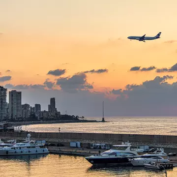 An airplane flies over Beirut. Ali Chehade Farhat/Shutterstock