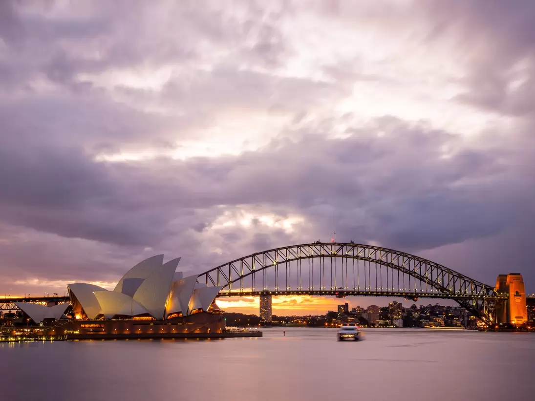Sydney, Australia - July 11, 2010 : Dramatic sky and the Sydney Opera House at dusk. Sydney skyline taken from Mrs. Macquarie's Point.; Shutterstock ID 185348105; Your name (First / Last): Josh Vogel; Project no. or GL code: 56530; Network activit...