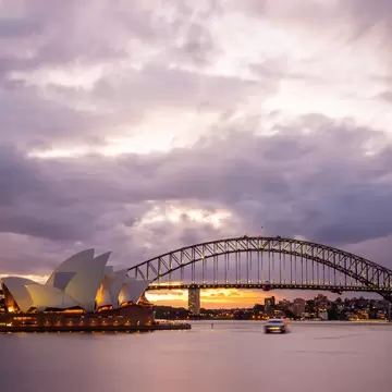 Sydney, Australia - July 11, 2010 : Dramatic sky and the Sydney Opera House at dusk. Sydney skyline taken from Mrs. Macquarie's Point.; Shutterstock ID 185348105; Your name (First / Last): Josh Vogel; Project no. or GL code: 56530; Network activit...