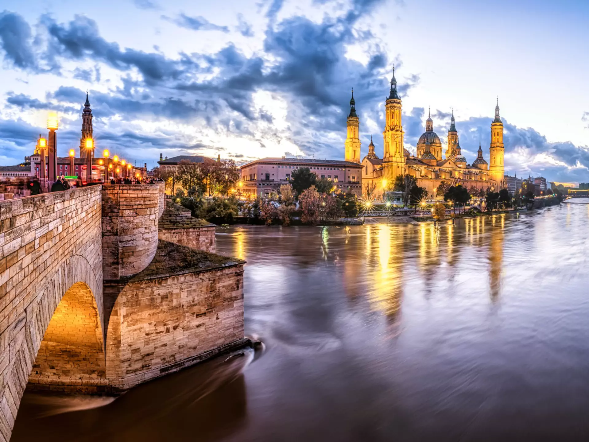 Basílica de Nuestra Señora del Pilar rising above the River Ebro in Zaragoza, Spain. 