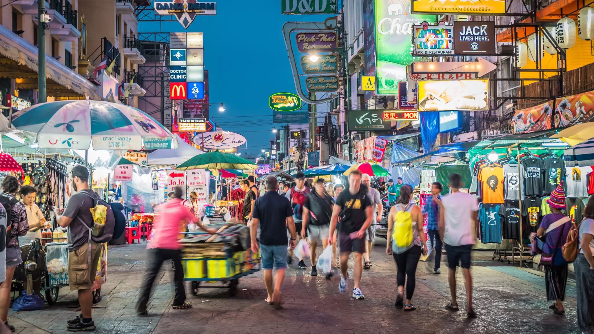 Motion-capture image of people on a bright, busy pedestrian street