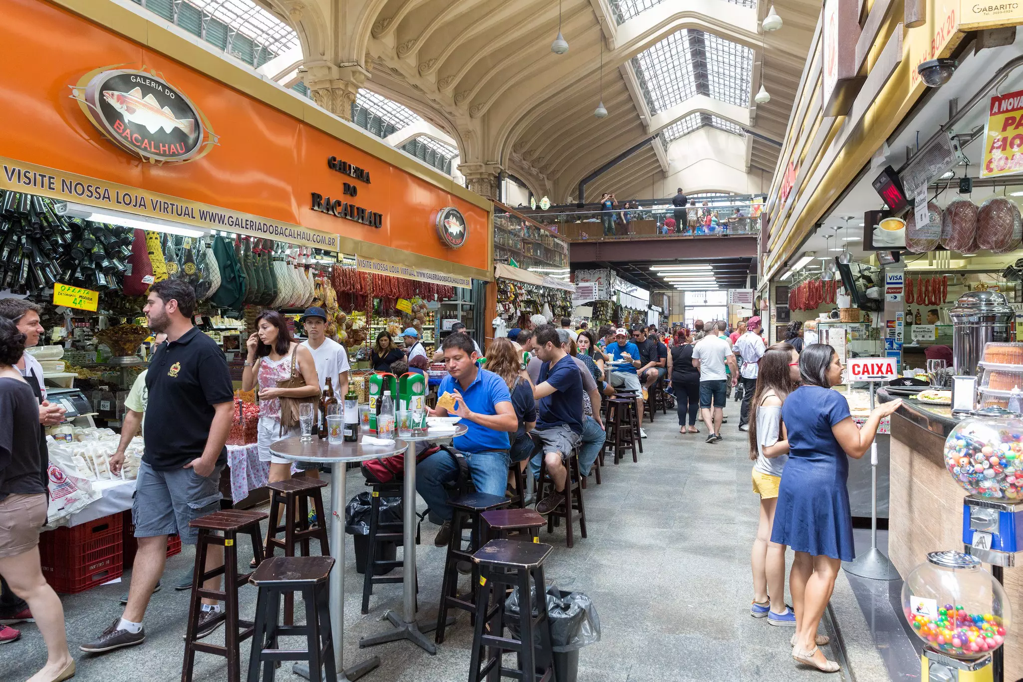People visiting the famous Municipal Market (Mercado Municipal) in Sao Paulo. Its a huge and bustling market with local fruit, vegetable, spice or condiment you could ask for.