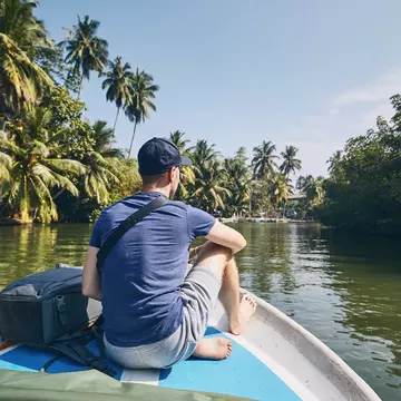 The serene waters of Sri Lanka's Madu River are best explored by boat. Chalabala / Getty Images