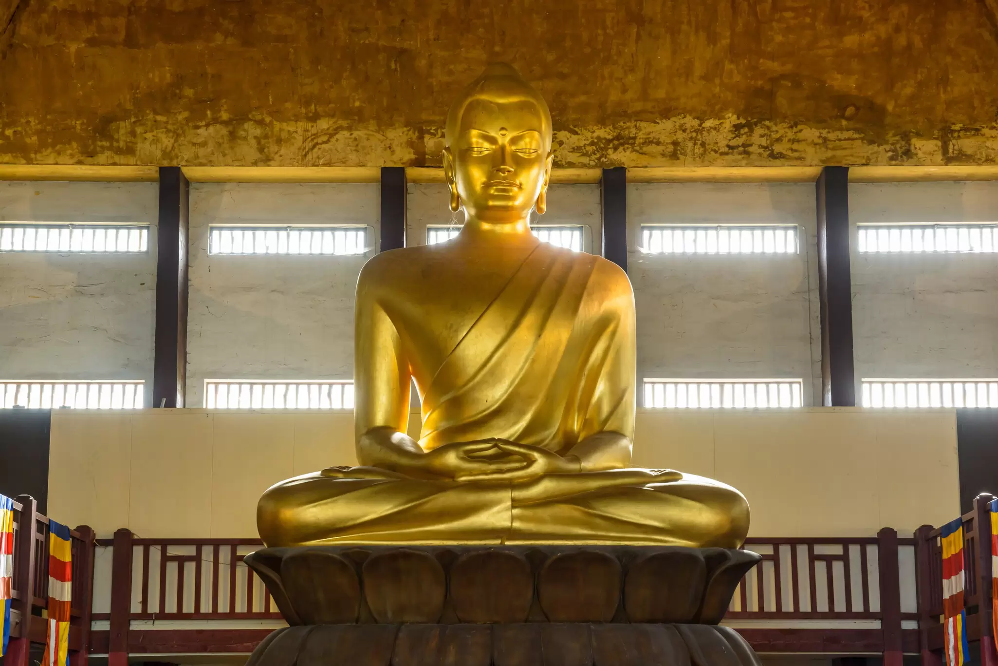 The 10 meters tall golden statue of Buddha in a Lotus pose, work of sculptor Francois Mozes sited in the Great Pagoda of the Bois de Vincennes.