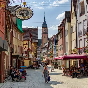 In Tauberbischofsheim, Bavaria, Germany on 08/24/2019. Main street full of establishments in a small town on the Romantic Road.   License Type: media  Download Time: 2023-08-31T01:12:26.000Z  User: mvm_lonelyplanet  Is Editorial: Yes  purchase_order:   