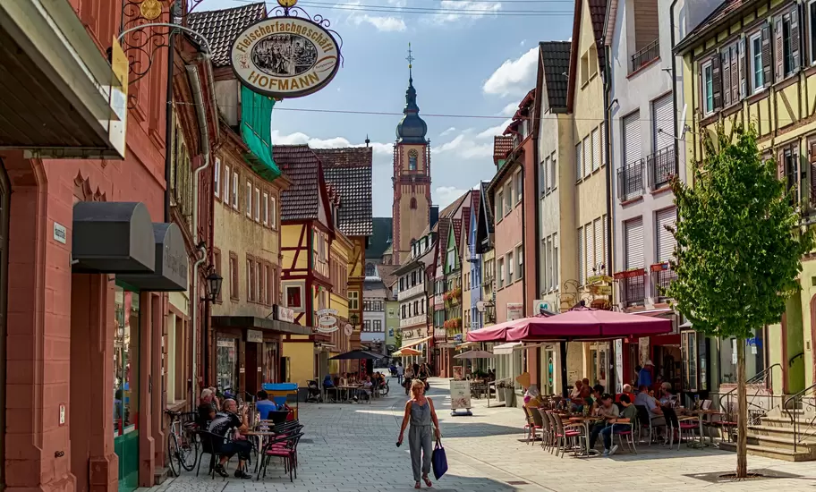 In Tauberbischofsheim, Bavaria, Germany on 08/24/2019. Main street full of establishments in a small town on the Romantic Road.   License Type: media  Download Time: 2023-08-31T01:12:26.000Z  User: mvm_lonelyplanet  Is Editorial: Yes  purchase_order:   