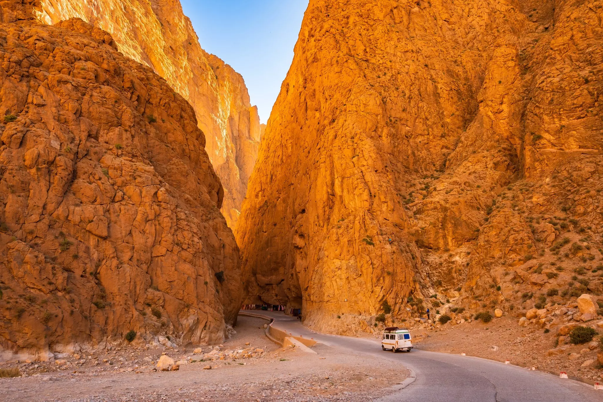 Car driving on narrow scenic road in Dades Gorge canyon with mountains in background, Morocco, North Africa, License Type: media, Download Time: 2025-03-27T20:56:04.000Z, User: dogutierrez_redventures, Editorial: false, purchase_order: 65020 - Marketing or Sales - this includes sponsored articles, job: Elsewhere, client: Elsewhere, other: Dory Gutierrez