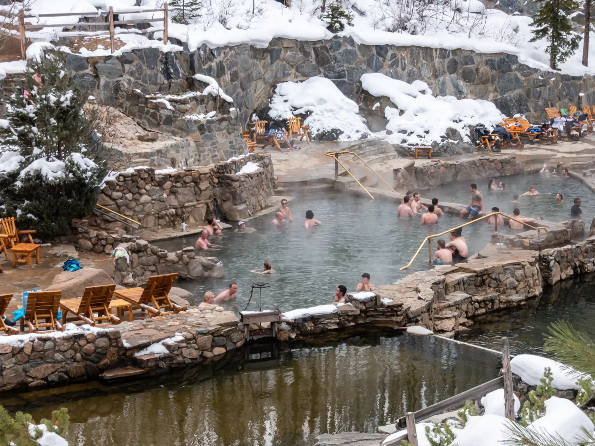 People enjoy the outdoor Strawberry Park Hot Springs.