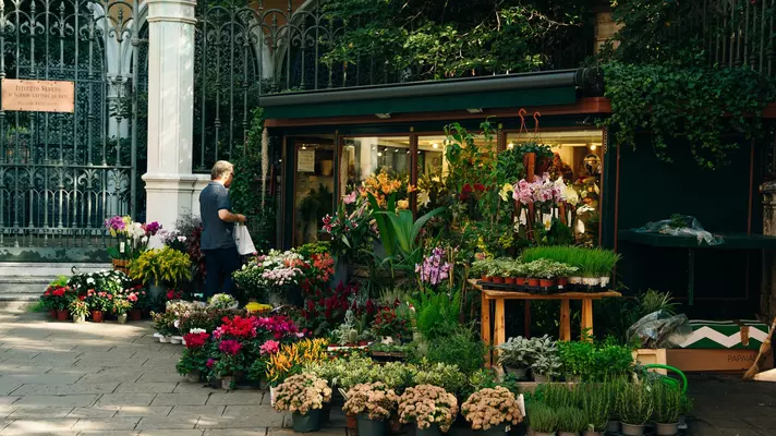 Flower shop on the street of the town of venice, italy