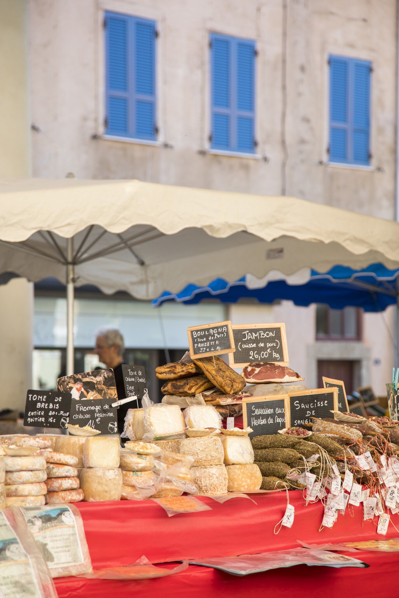 Assorted meat and cheese delicacies at L’Île-Rousse’s covered market in Old Town. Corsica, France.
