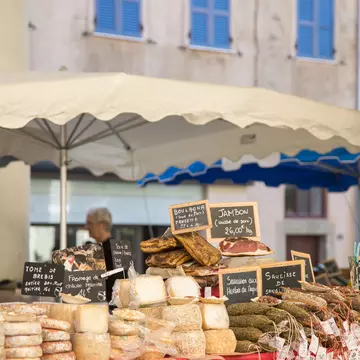 Assorted meat and cheese delicacies at L’Île-Rousse’s covered market in Old Town. Corsica, France.