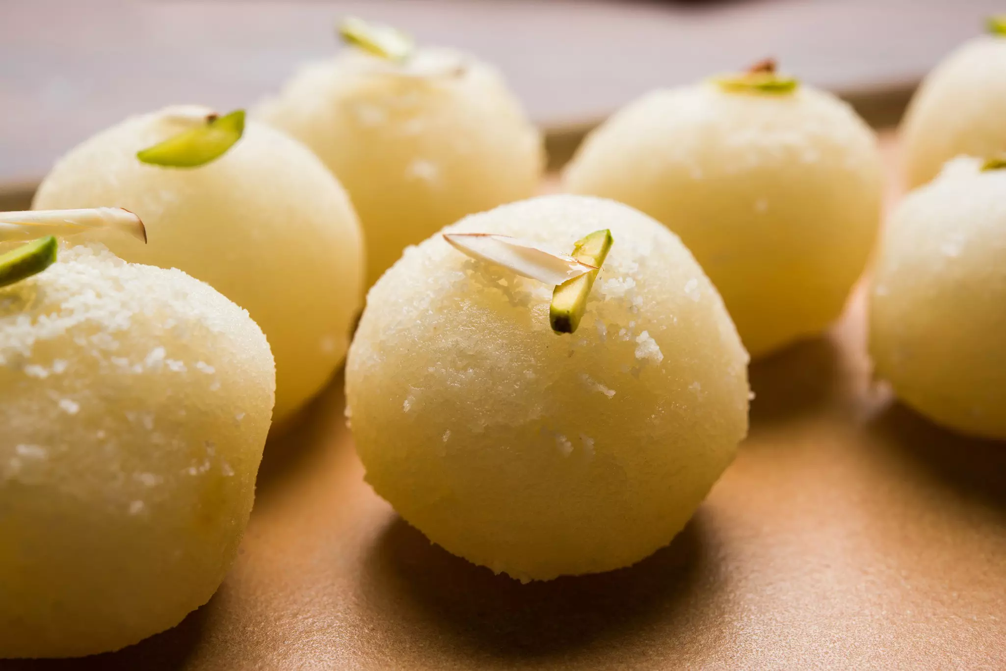 Rasgulla or sponge Ras Gulla is made from ball-shaped dumplings of chhena and semolina dough, cooked in light syrup made of sugar. ©subodhsathe/Getty Images