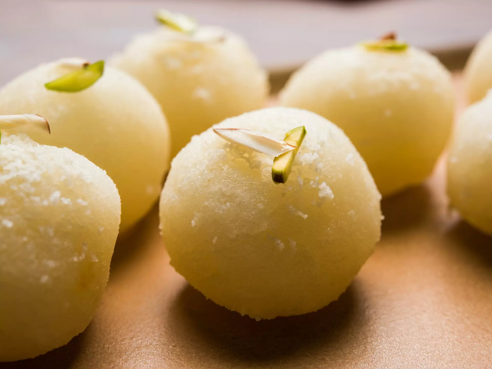 Rasgulla or sponge Ras Gulla is made from ball-shaped dumplings of chhena and semolina dough, cooked in light syrup made of sugar. ©subodhsathe/Getty Images