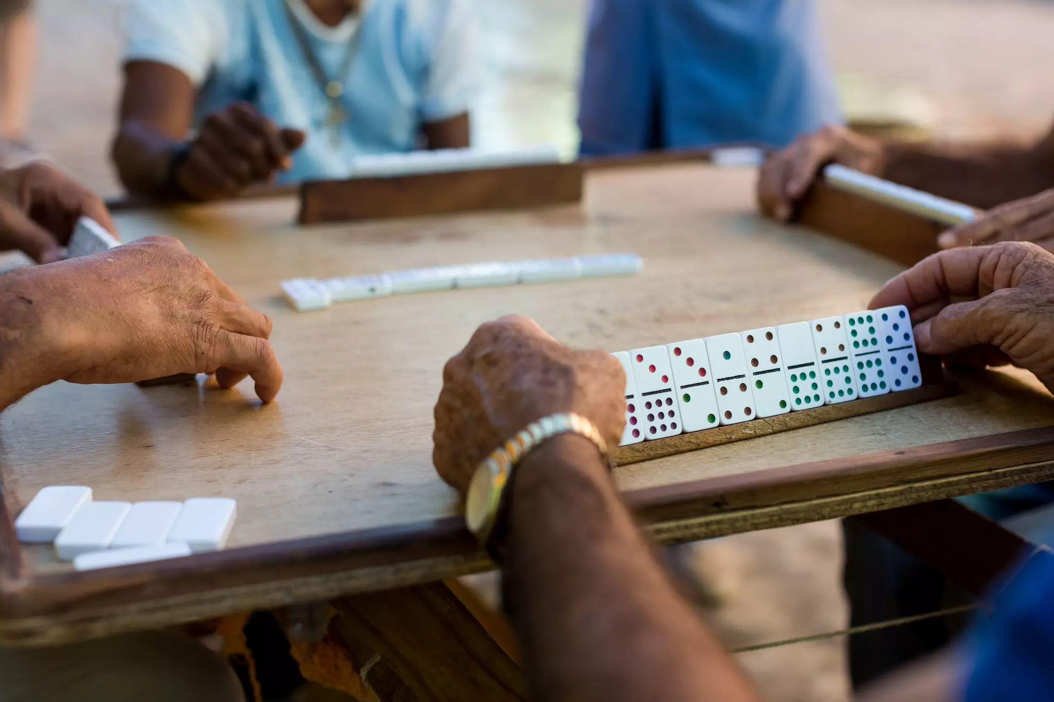 Boisterous games of dominoes are everywhere in Cuba © Cavan Images / Getty Images