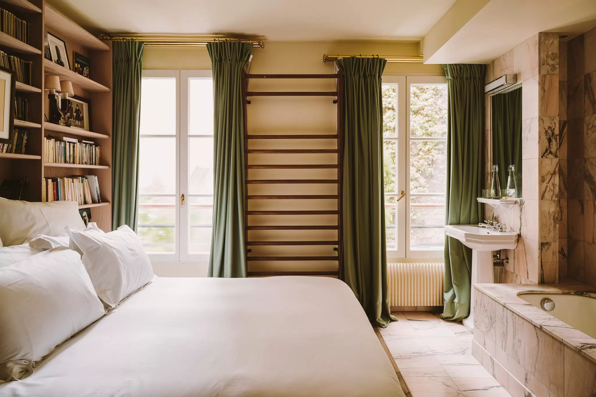 A book lover's dream room at Hotel Amour in Paris, France. PionPhotographie, via Hotel Amour