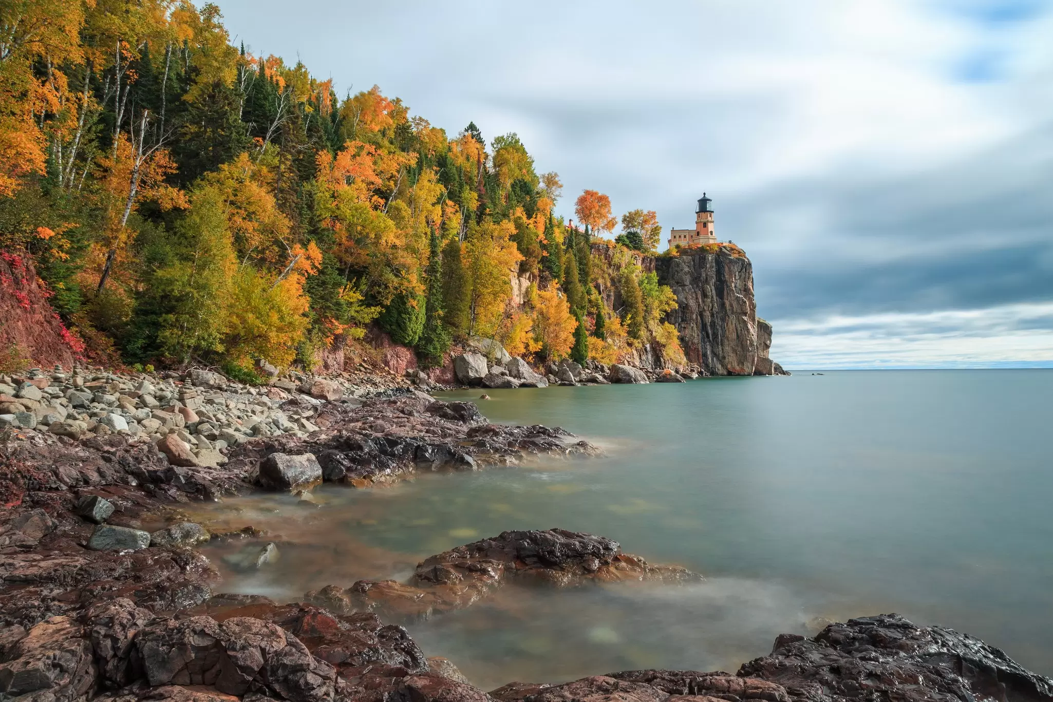 Fall foliage frames the Split Rock Lighthouse on Lake Superior's North Shore, Minnesota, USA.