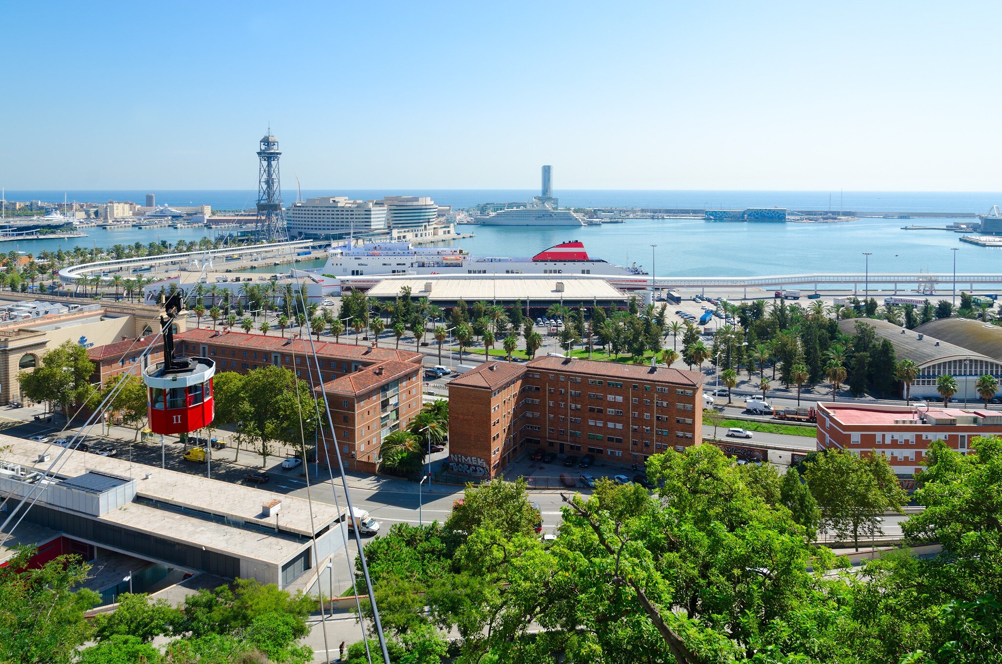Telefèric de Montjuïc cableway, as seen from Mount Montjuic and heading to the Old Port.