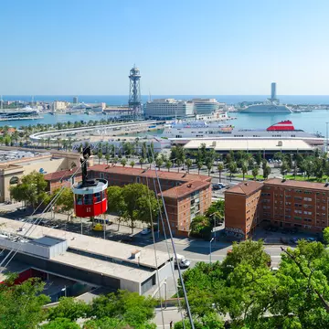 Telefèric de Montjuïc cableway, as seen from Mount Montjuic and heading to the Old Port.