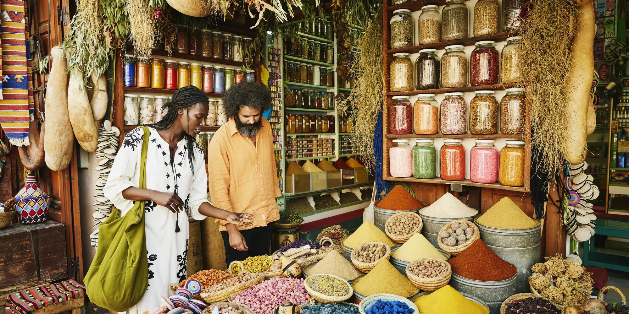 Wide shot of couple shopping in spice shop in the souks of Marrakech while on vacation
1464913108
exotic travel