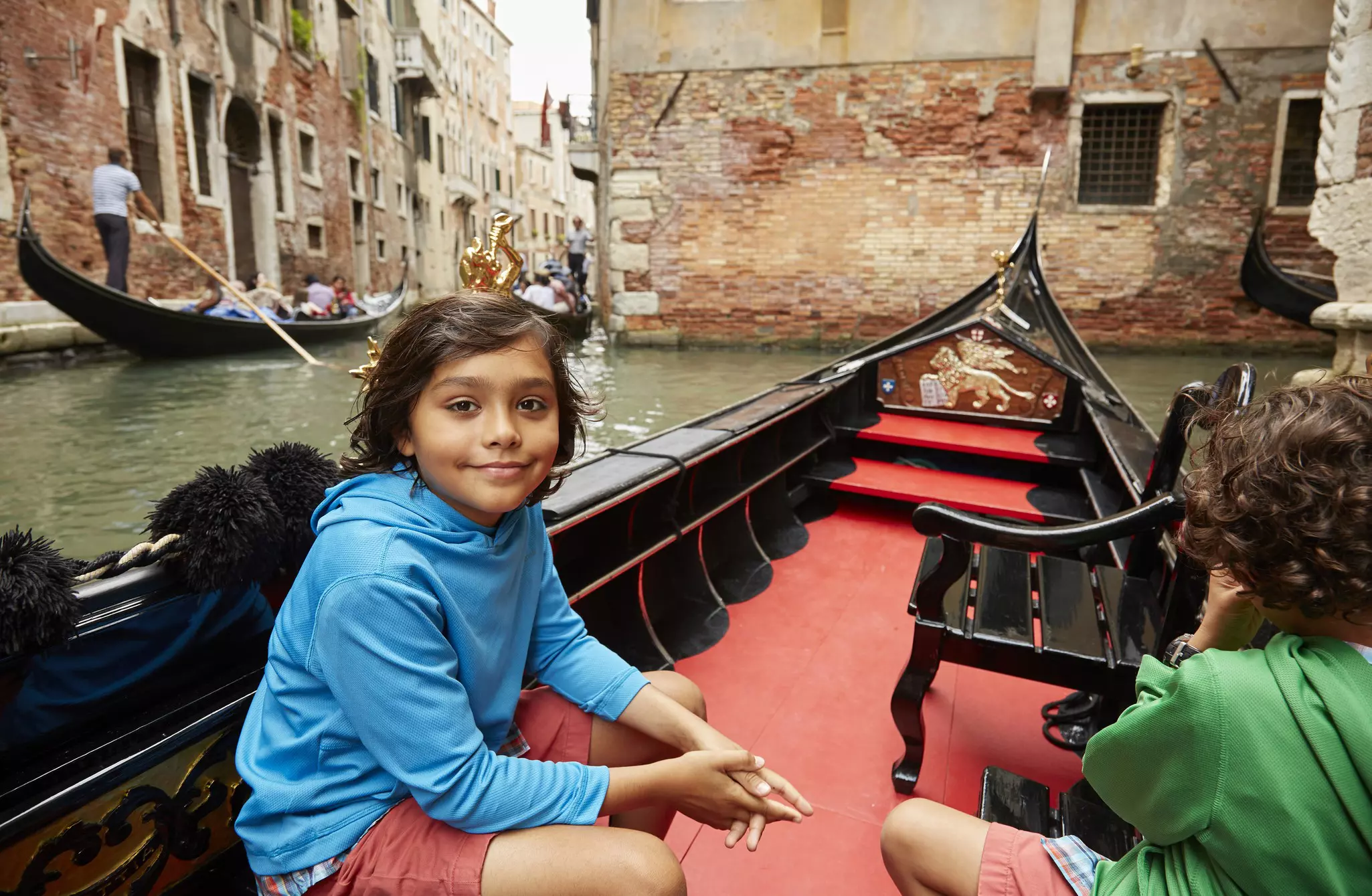 Children absolutely love to ride on a gondola or vaporetto on Venice's canal © Mike Tauber / Getty Images