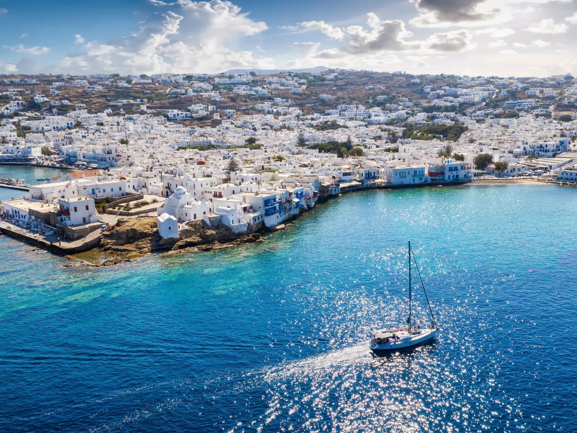 Sailing past the village of Ornos, Mykonos. Sven Hansche/EyeEm/Getty Images