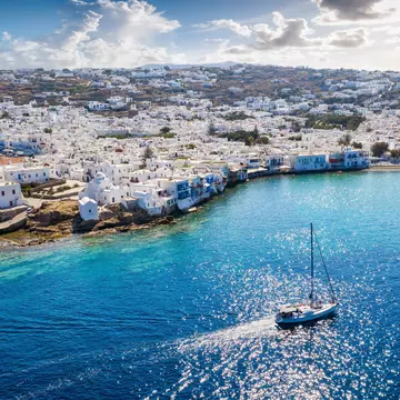 Sailing past the village of Ornos, Mykonos. Sven Hansche/EyeEm/Getty Images