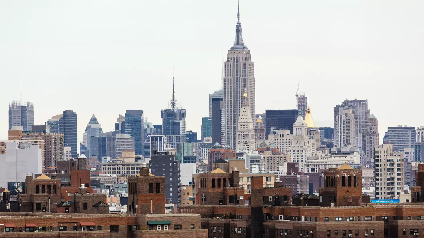 Manhattan skyline with Lower East Side on foreground and Empire State Building in the background.