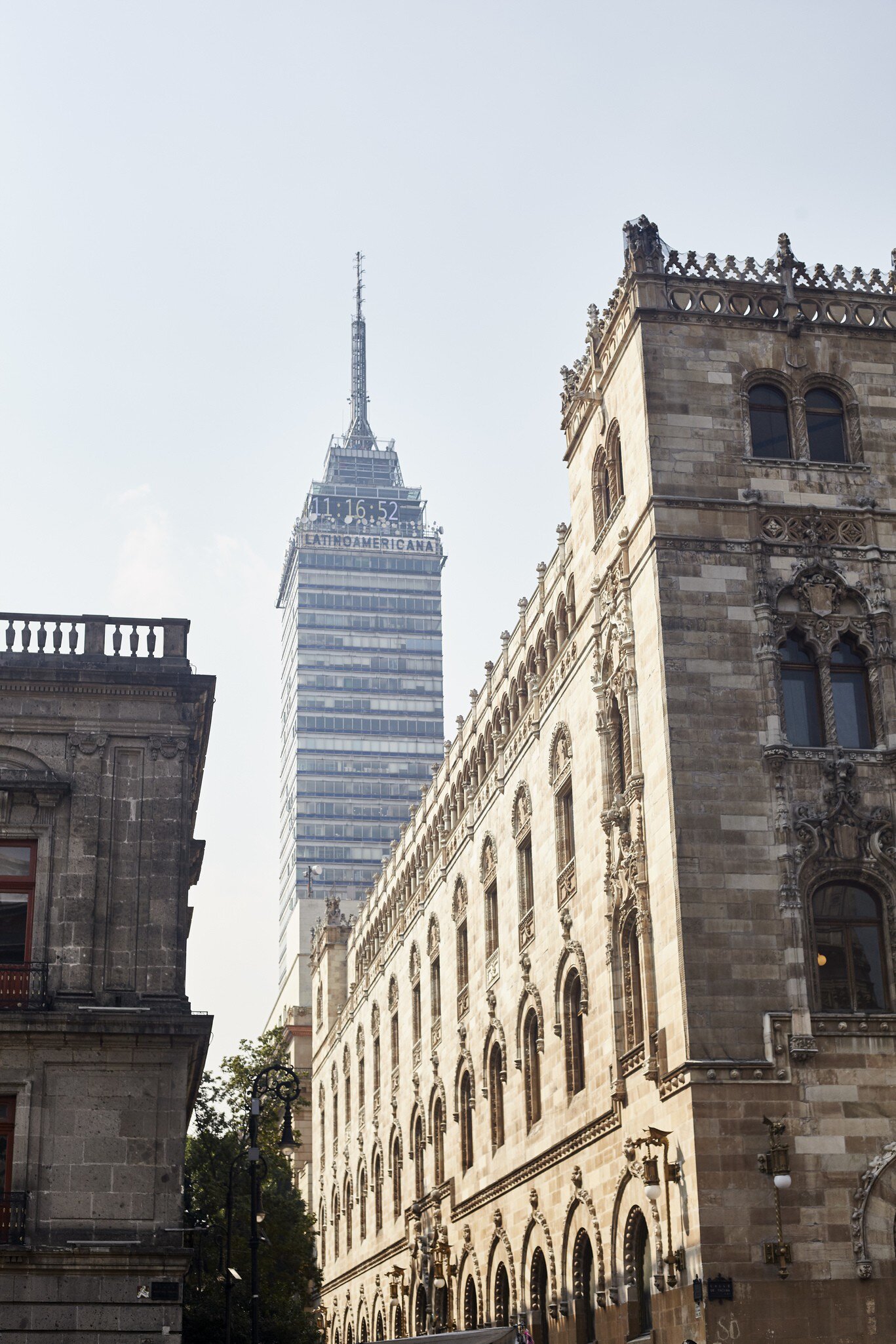 The skyscraper Torre Latinoamericana rises up from between the buildings in the historical center of Mexico City.