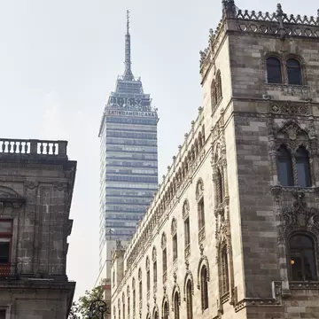 The skyscraper Torre Latinoamericana rises up from between the buildings in the historical center of Mexico City.
