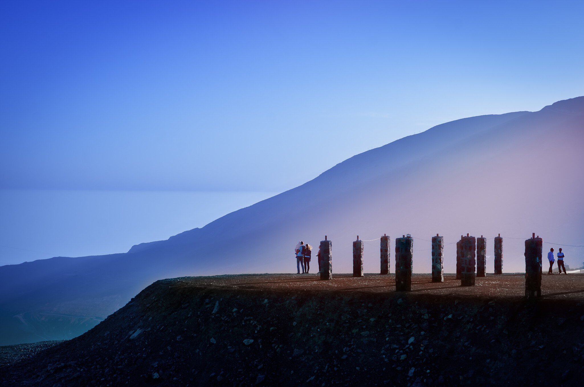 People enjoying the view during blue hour after sunset at the Jebel Jais mountains in Ras Al Khaimah.