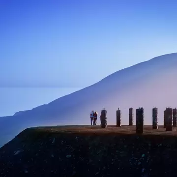 People enjoying the view during blue hour after sunset at the Jebel Jais mountains in Ras Al Khaimah.