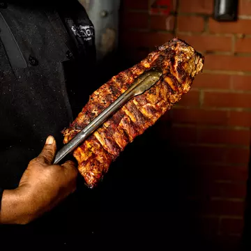 For dry rub ribs, it's got to be Charlie Vergos' Rendezvous in Memphis. Charlie Vergos' Rendezvous