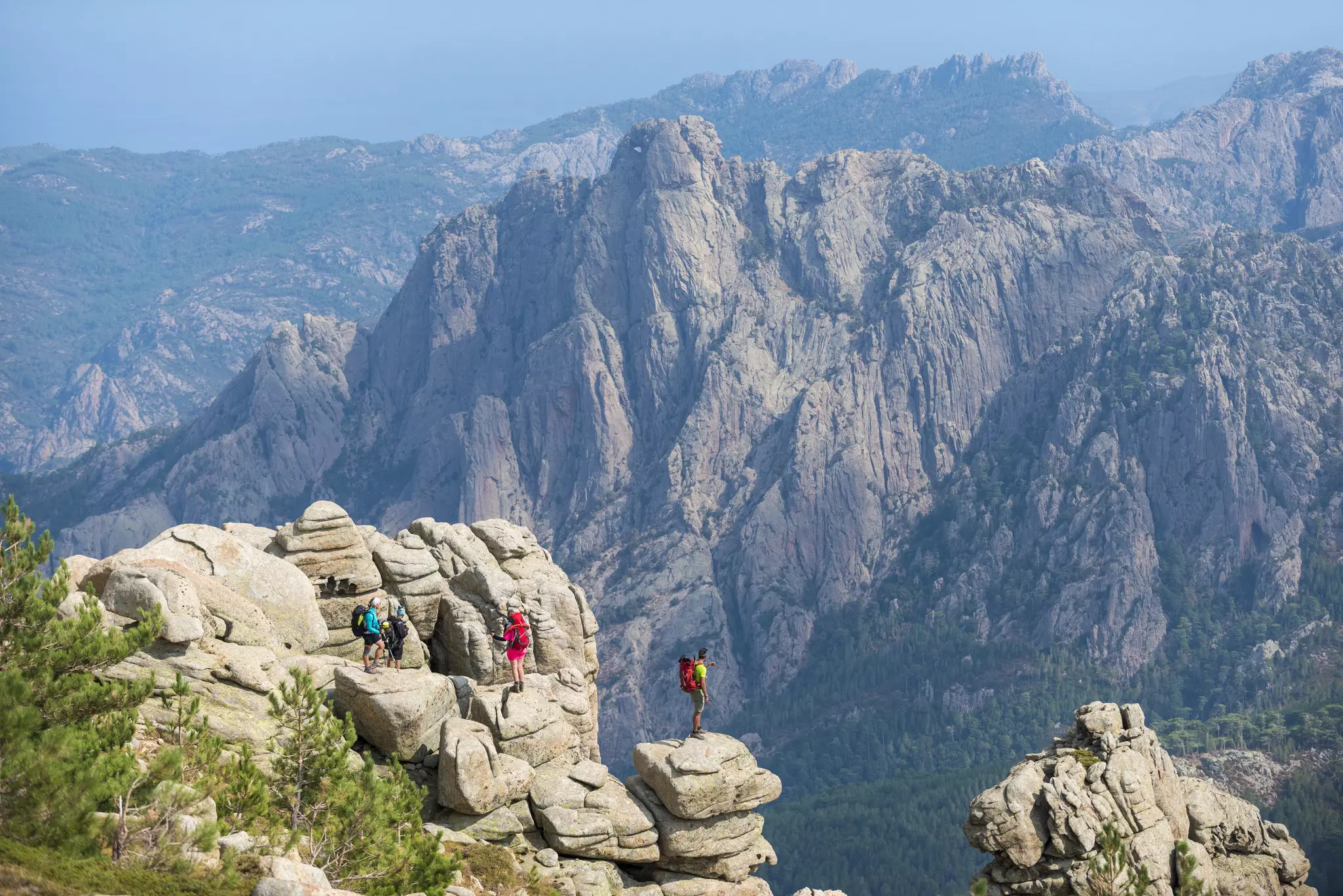 Hikers on a long-distance mountain trail pause to enjoy the scenery