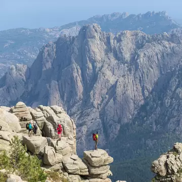 Trekking on the GR20 trail in Corsica near the Aiguilles de Bavella hiking towards Refuge d'Asinao