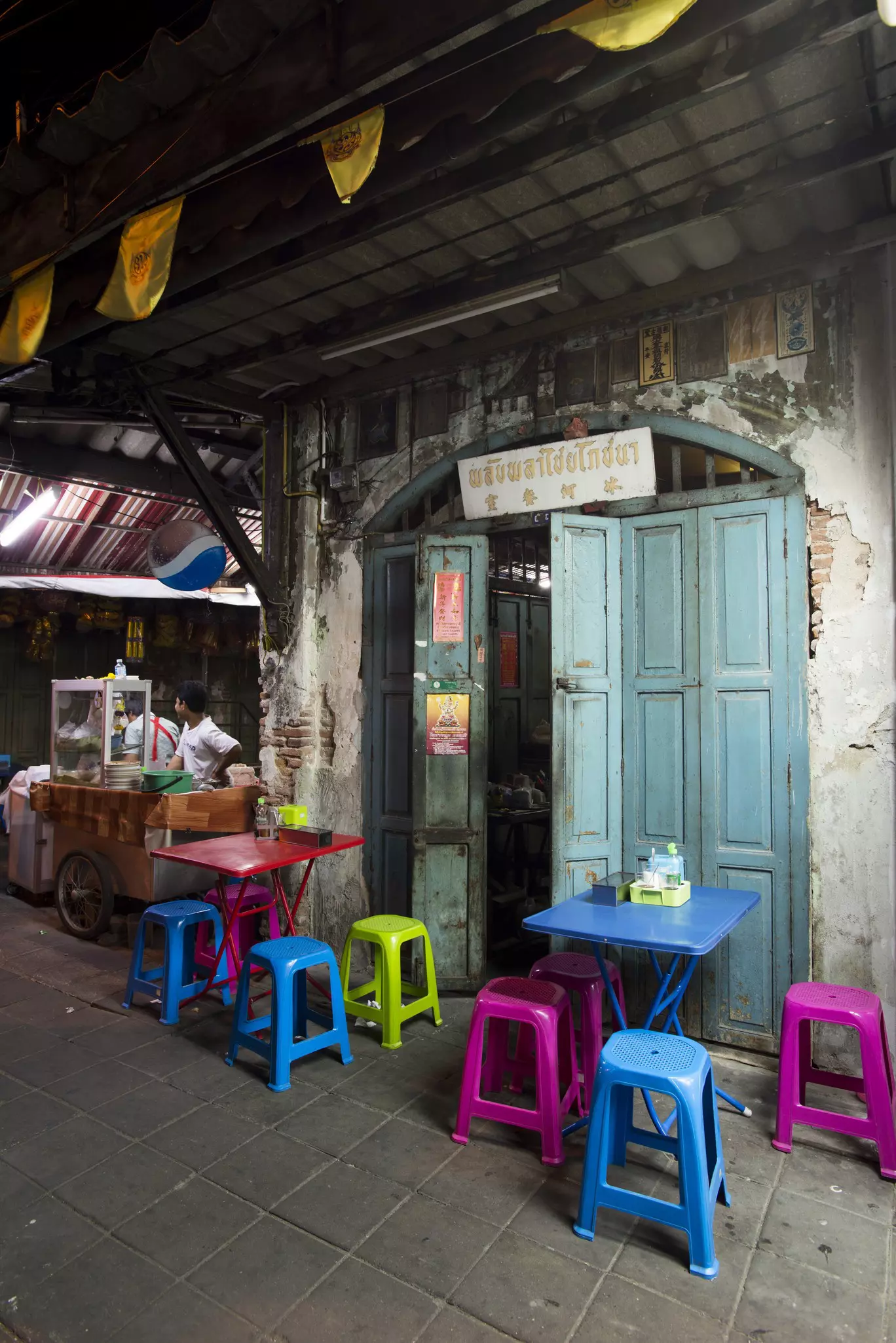 A woman holds a plastic bottle to the mouth of a baby rhino at Kruger National Park Rhino orphanage