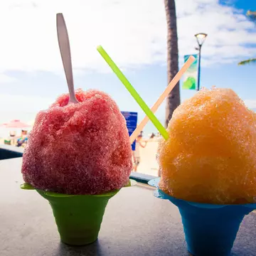 Shave ice is a summery treat served with colorful, syrupy toppings, sold across Hawaii © rustyl3599 / Getty Images