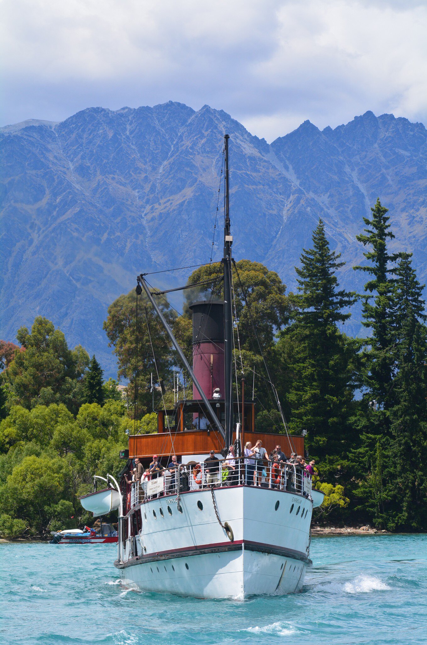 QUEENSTOWN, NZ - JAN 16 2014:TSS EarnslawIt's steamship one of the oldest tourist attractions in Otago and the only remaining commercial passenger coal-fired steamship in the southern hemisphere.  License Type: media  Download Time: 2023-04-21T10:36:32.000Z  User:   Is Editorial: Yes  purchase_order:   