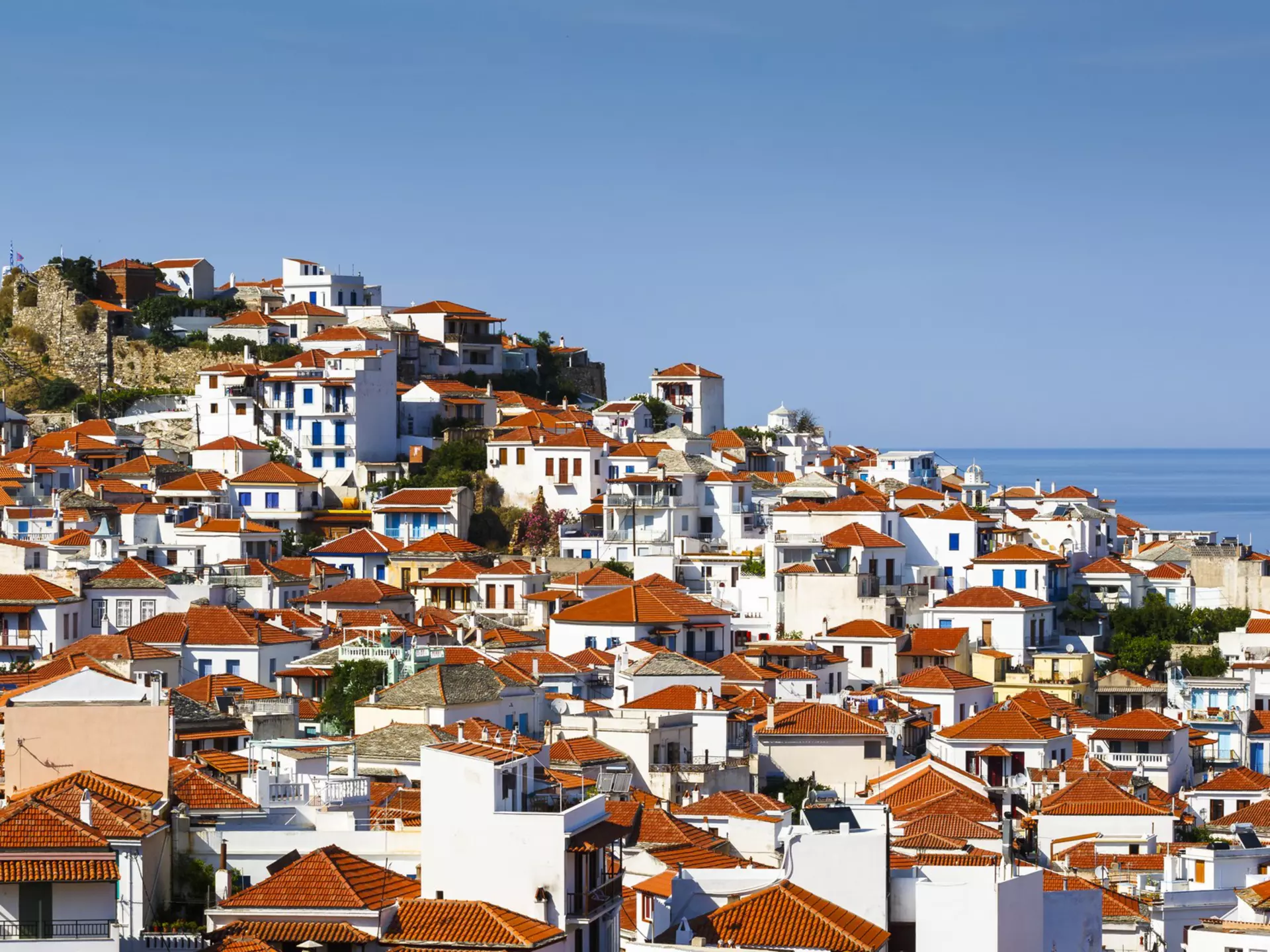 White houses with red roofs in Skopelos town, Greece., License Type: media, Download Time: 2025-12-05T19:16:18.000Z, User: LP_YKhanna, Editorial: false, purchase_order: 65050 - Digital Destinations and Articles, job: LP, client: App Content, other: Yuvraj Khanna
