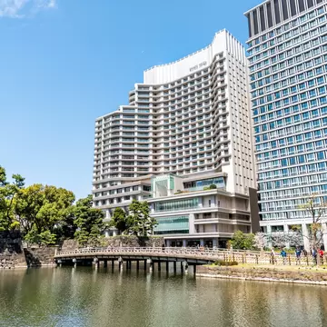 Exterior of a large hotel on a waterfront in Tokyo