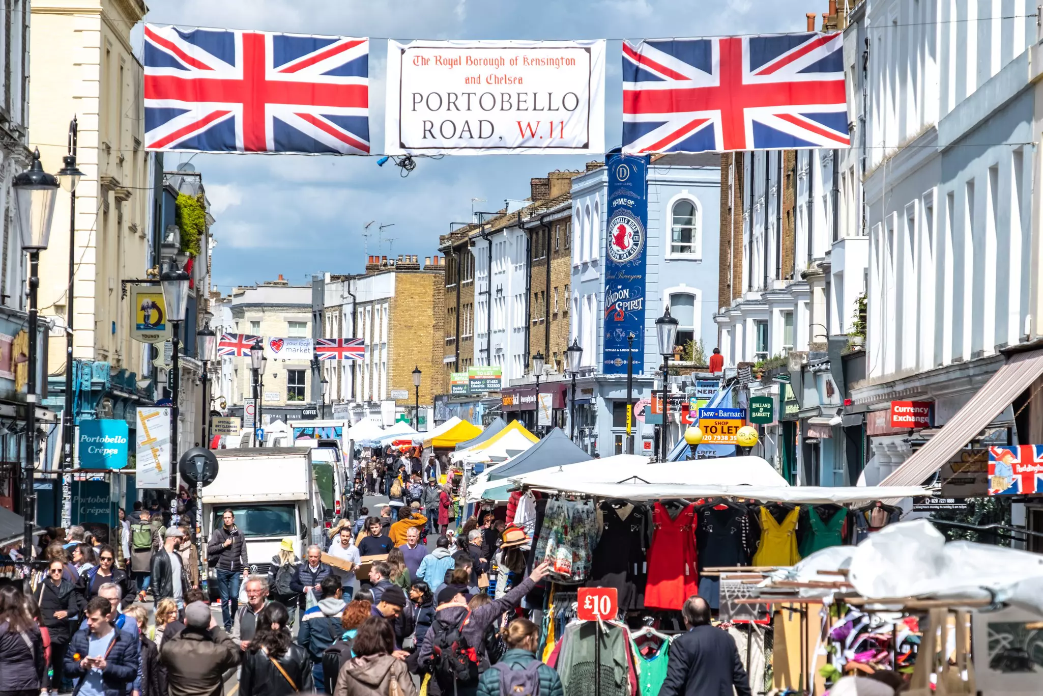 LONDON- APRIL, 2019: Portobello Road Market, a famous antiques street market in Notting Hill in west London  License Type: media  Download Time: 2022-01-17T23:40:37.000Z  User: mvm_lonelyplanet  Is Editorial: Yes  purchase_order:   