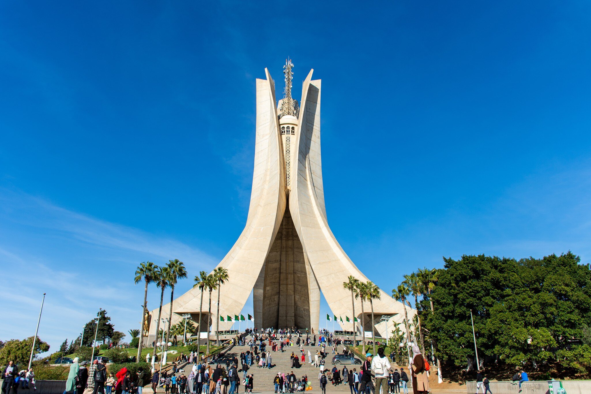 A group of people in Maqam Echahid Monument Square on vacation day in Algiers City, Algeria.