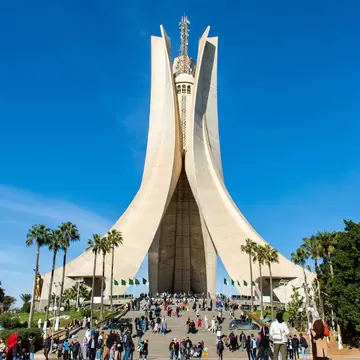 A group of people in Maqam Echahid Monument Square on vacation day in Algiers City, Algeria.