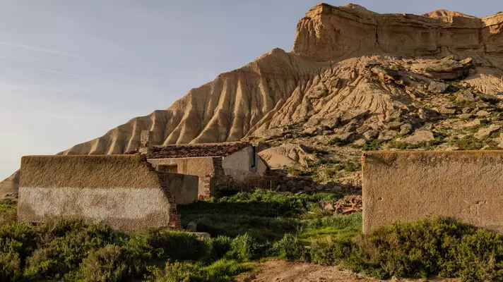Buildings on a hillside with rock formations.