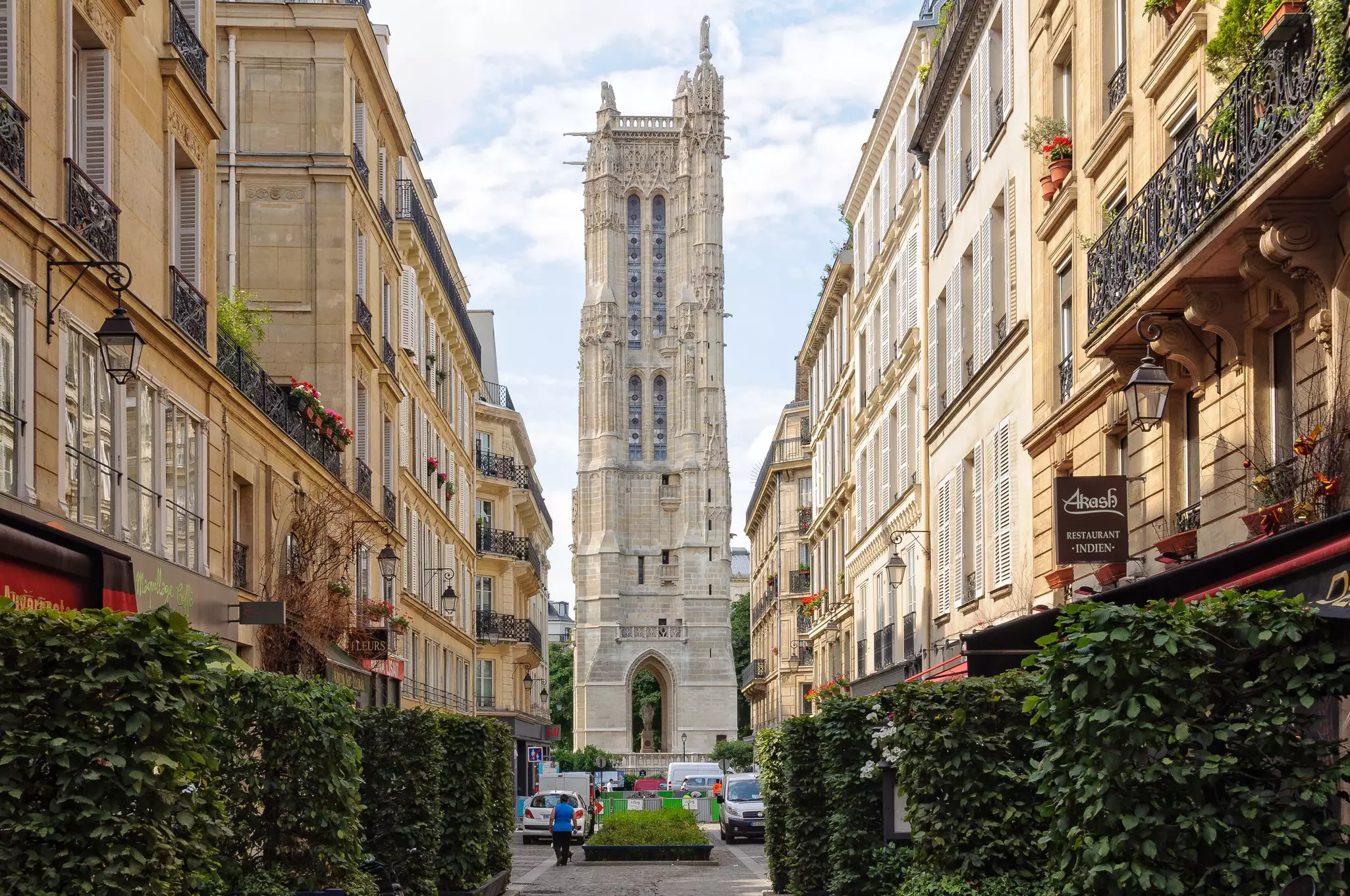 A view of Saint-Jacques Tower at the end of the street in Paris. 
