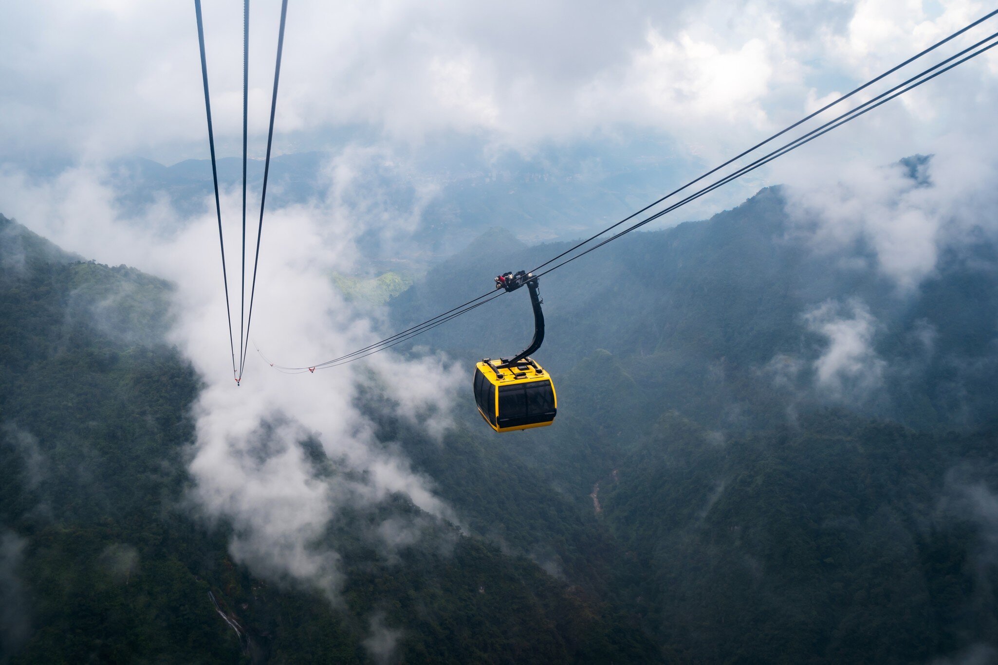 The world's longest electric cable car to Fan Si Pan mountain peak, the highest mountain of Indochina, with mist over the mountains